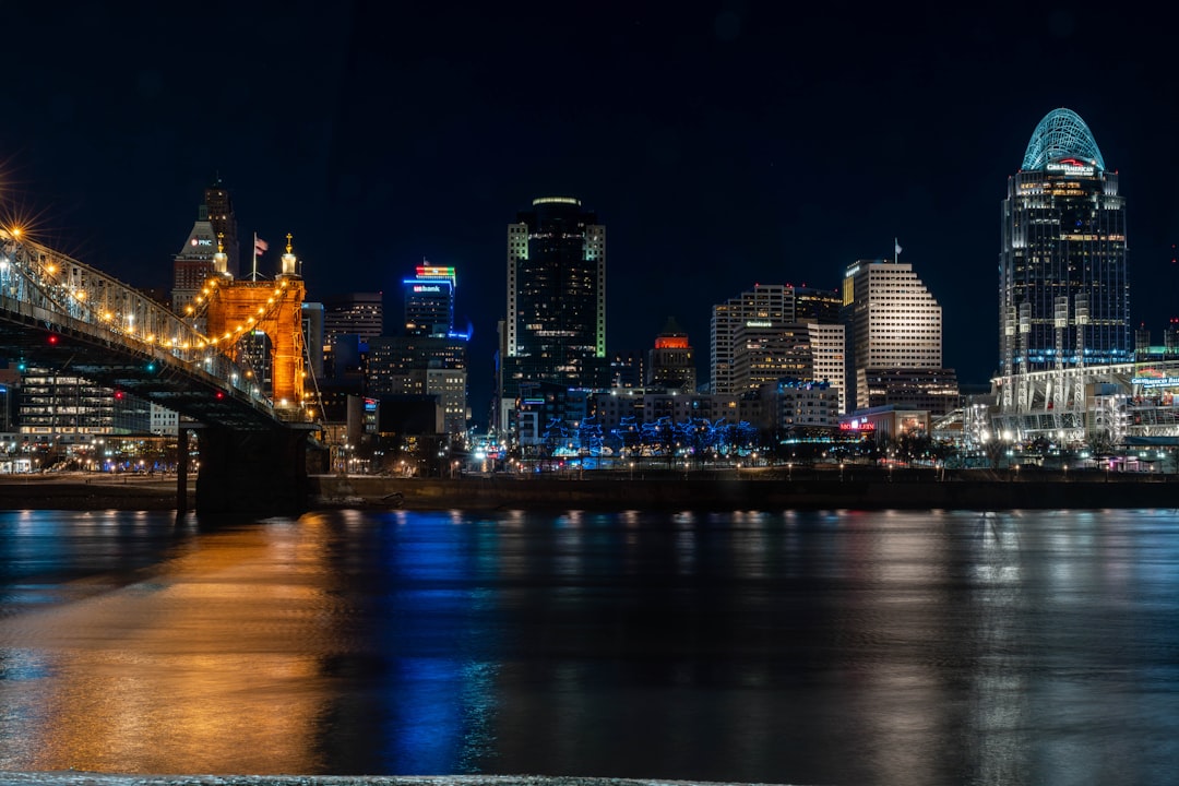 a-night-view-of-a-city-with-a-bridge-over-the-water-30uz2cu3jzq